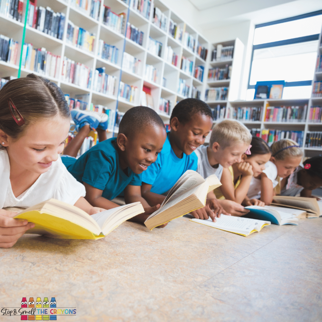 Help your students build a wide variety of reading comprehension skills. This image shows students reading in a small group.